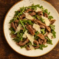 Straccetti con rucola e parmigiano