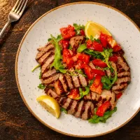Tagliata di vitello con rucola e pomodoro
